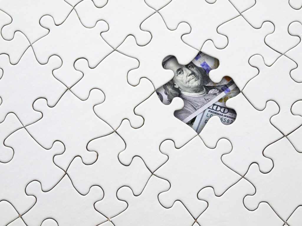 Money under a puzzle